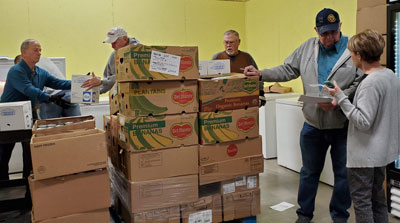Unloading food at Whitney Food Bank